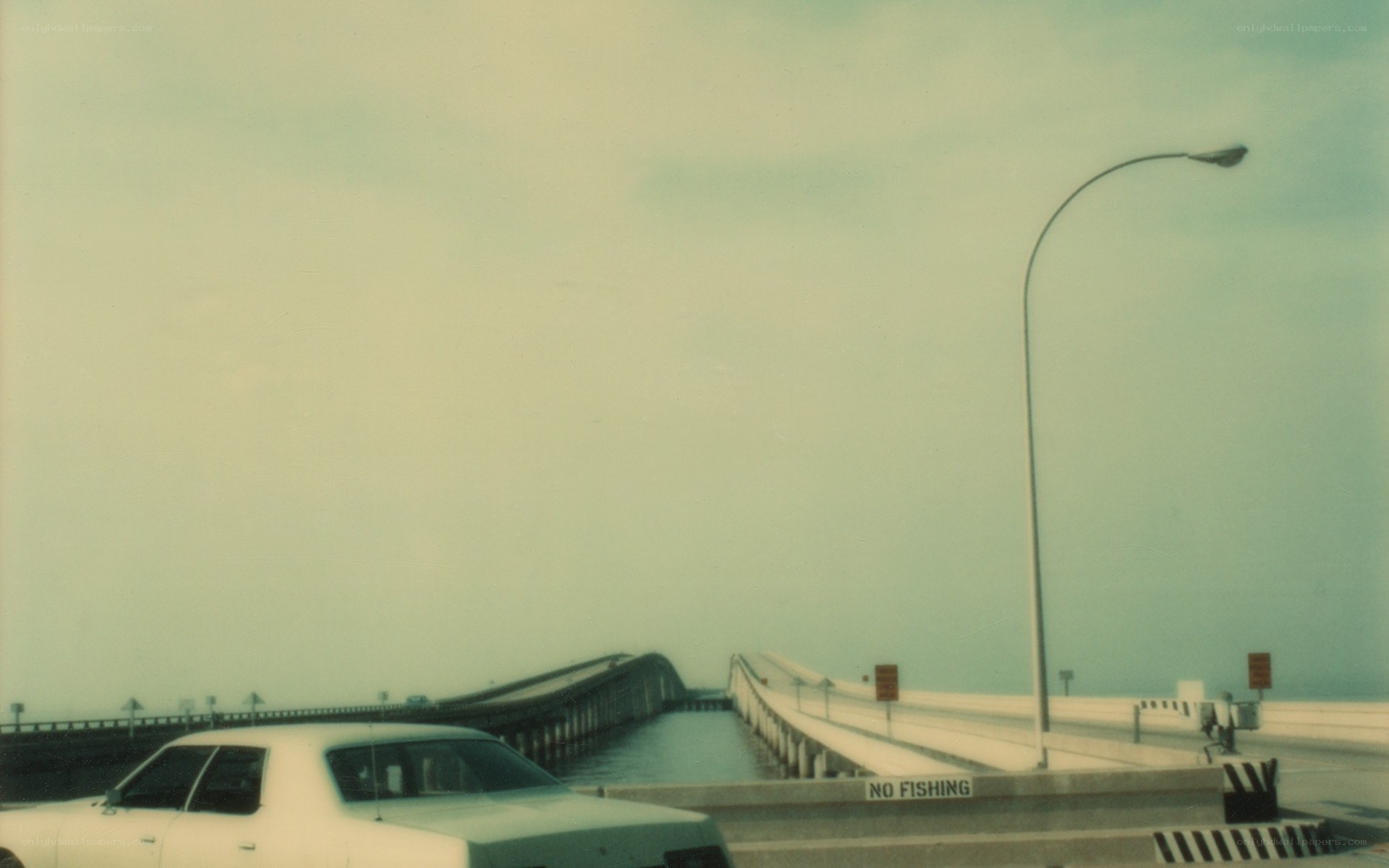 Car on a long bridge