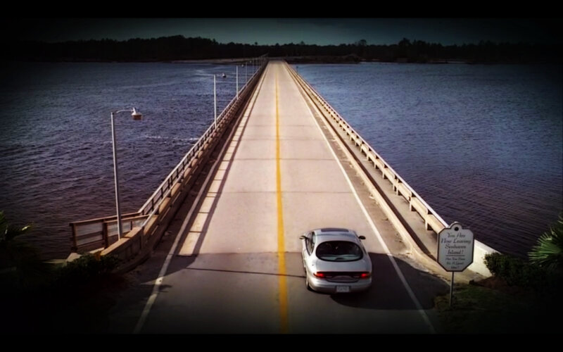 Car on a long bridge
