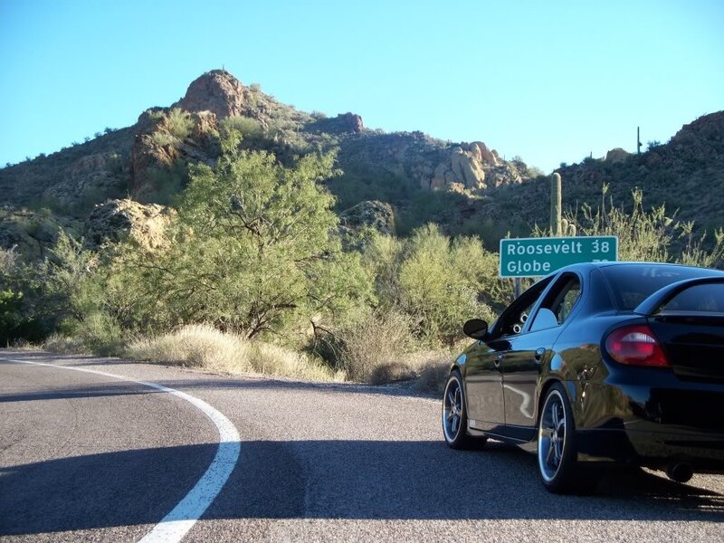 Car on desert road near Roosevelt