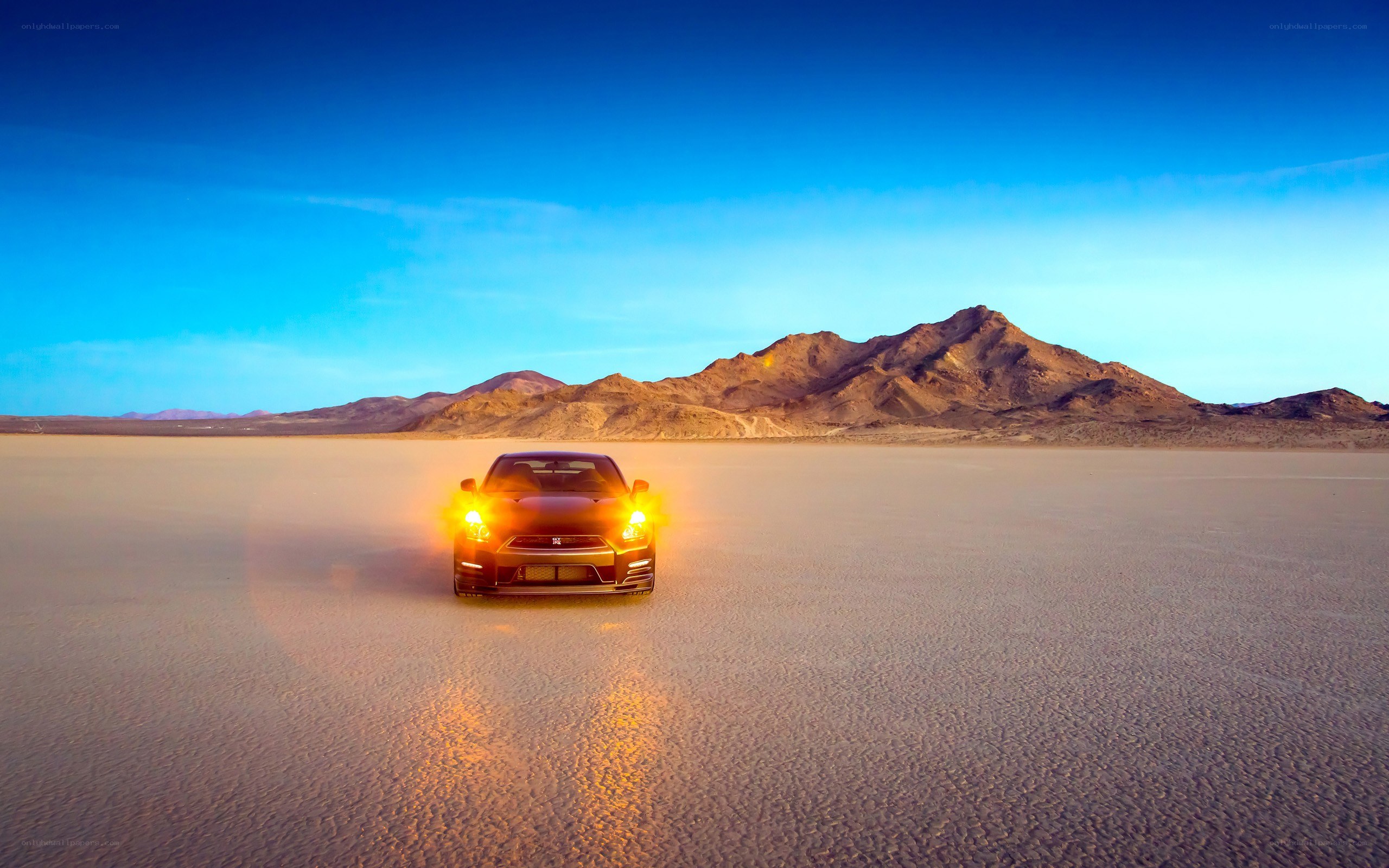 Car on desert salt flat