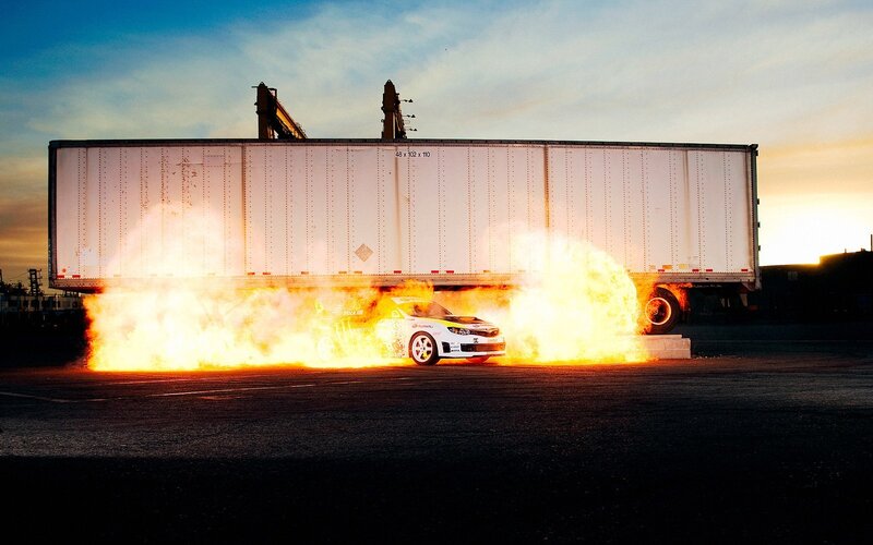 Car on fire near truck