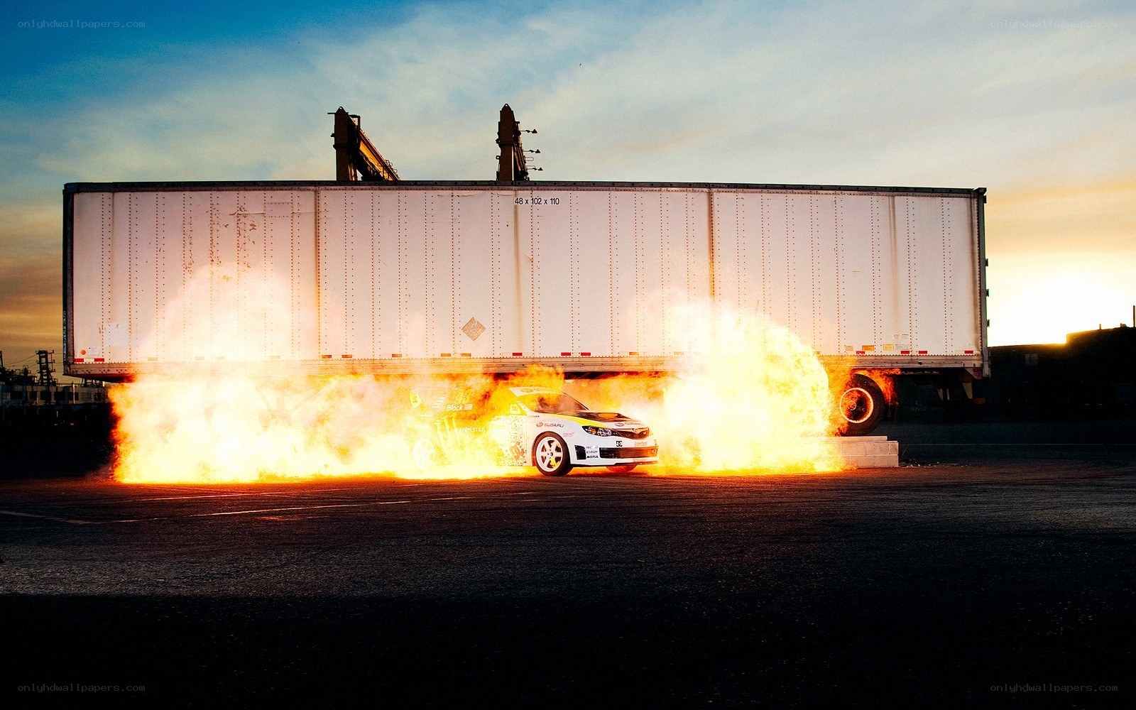 Car on fire near truck