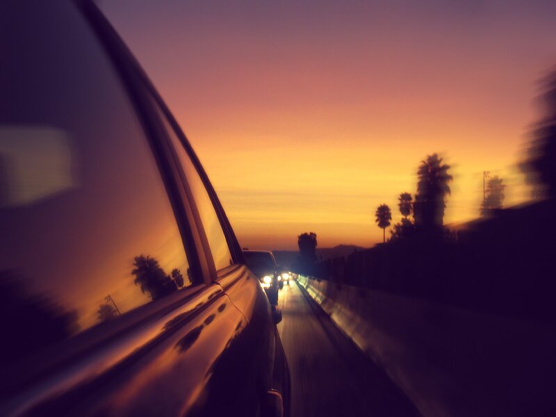 Car on Highway at Sunset — Orange