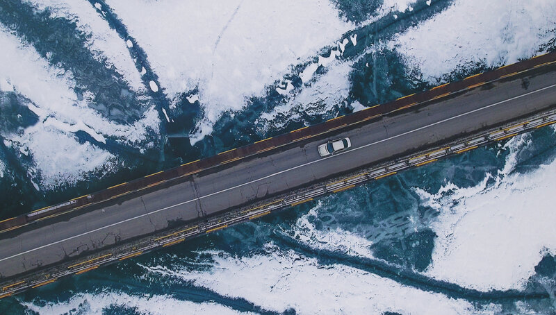 Car on Icy Bridge
