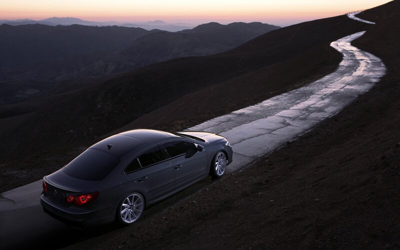 Car on mountain road at dusk
