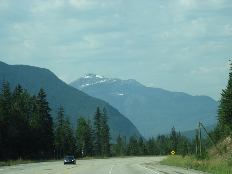 Car on Mountain Road — Green, Serene, Afternoon, Photograph, Forest