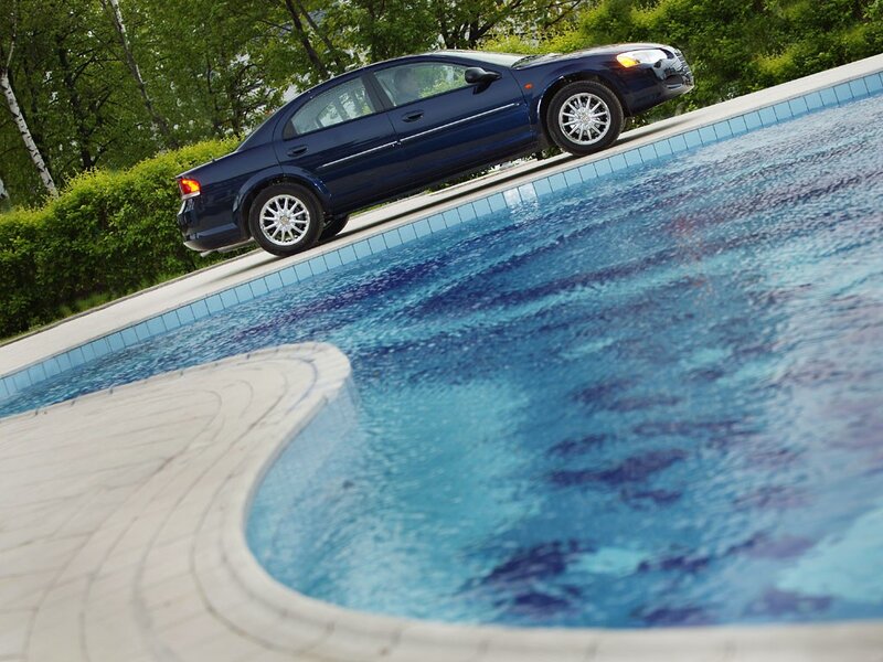 Car on pool edge