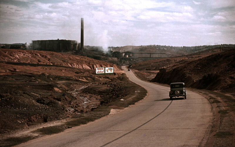 Car on road near industrial site