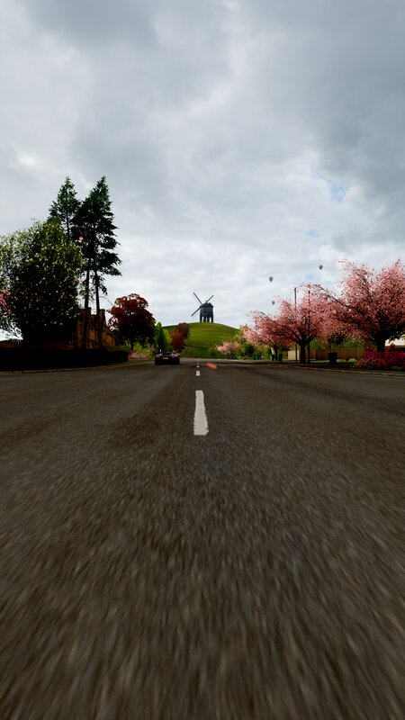 Car on Road to Windmill