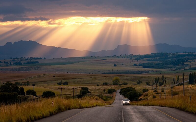 Car on Rural Road — Yellow