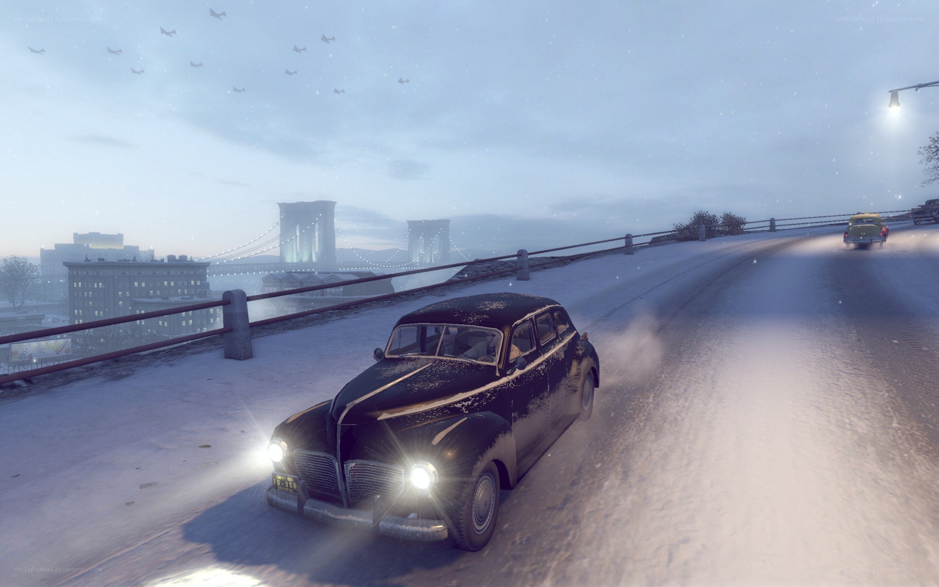Car on snowy bridge