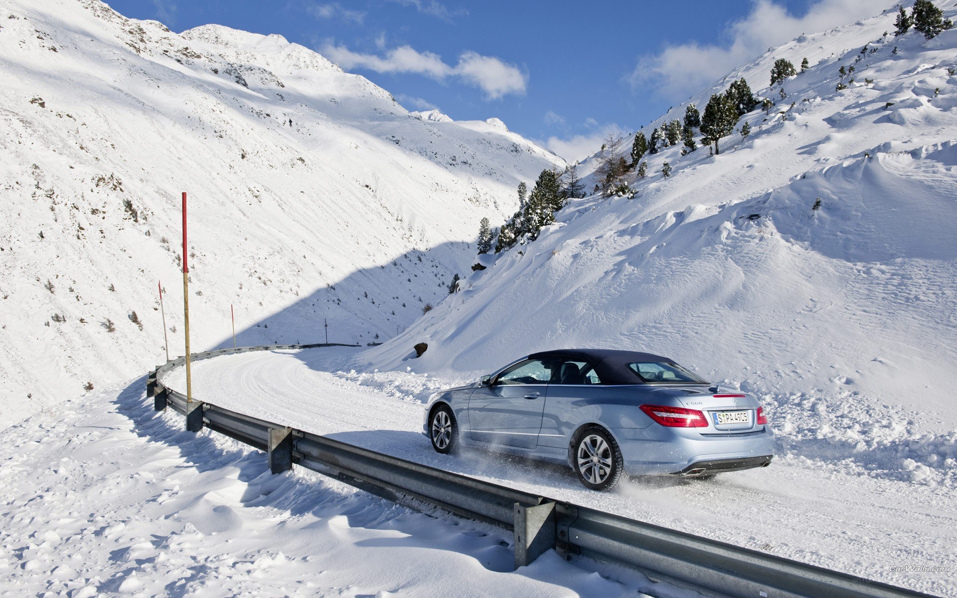 Car on snowy mountain road