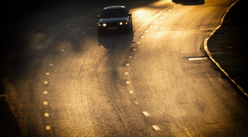 Car on Wet Road — Black