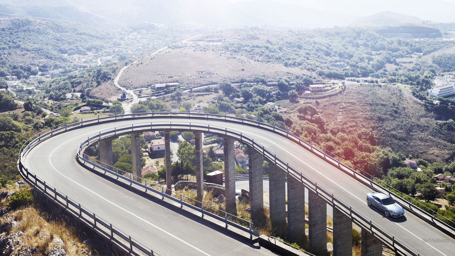car on winding bridge