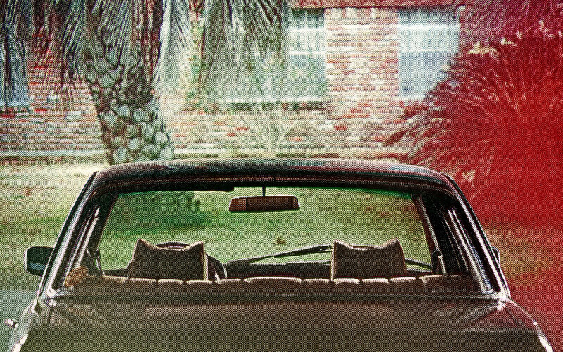 car parked in front of house