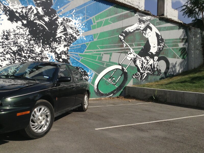 Car Parked Near Mural