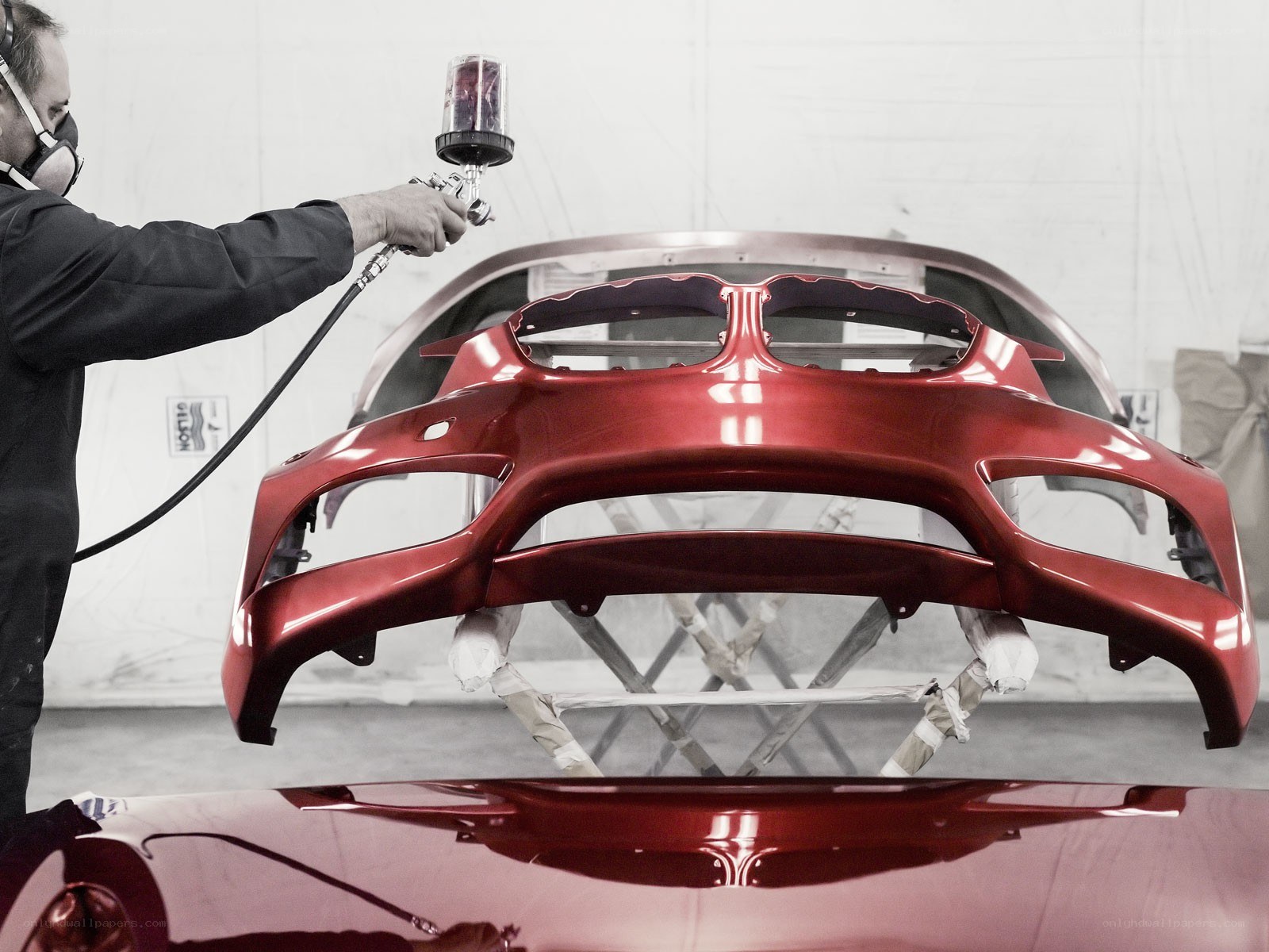 Car part being painted