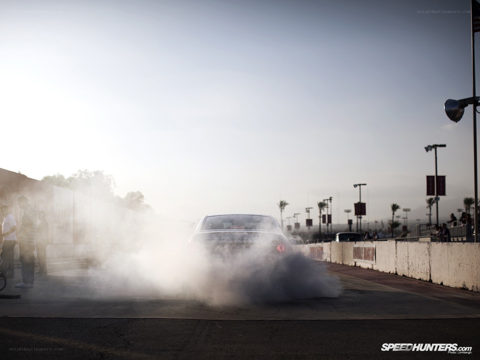Car performing burnout on track