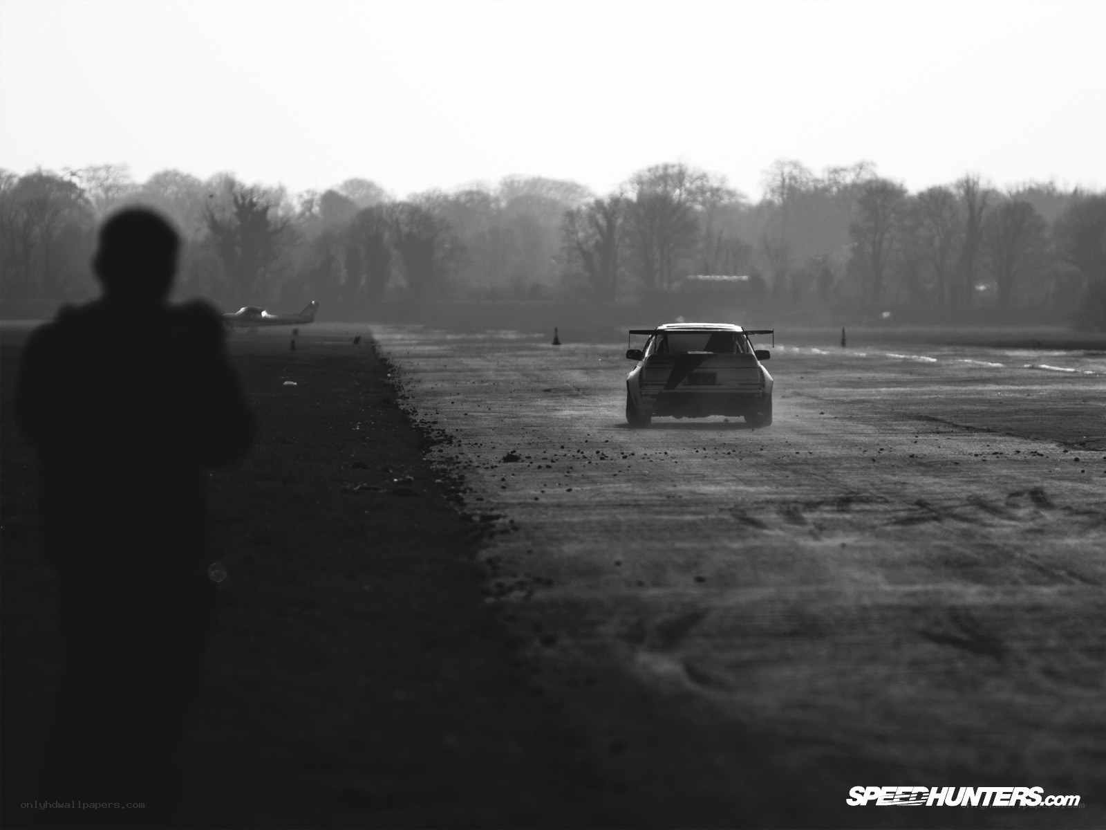 Car racing on a runway