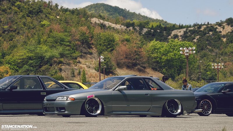 Car show in a mountain parking lot