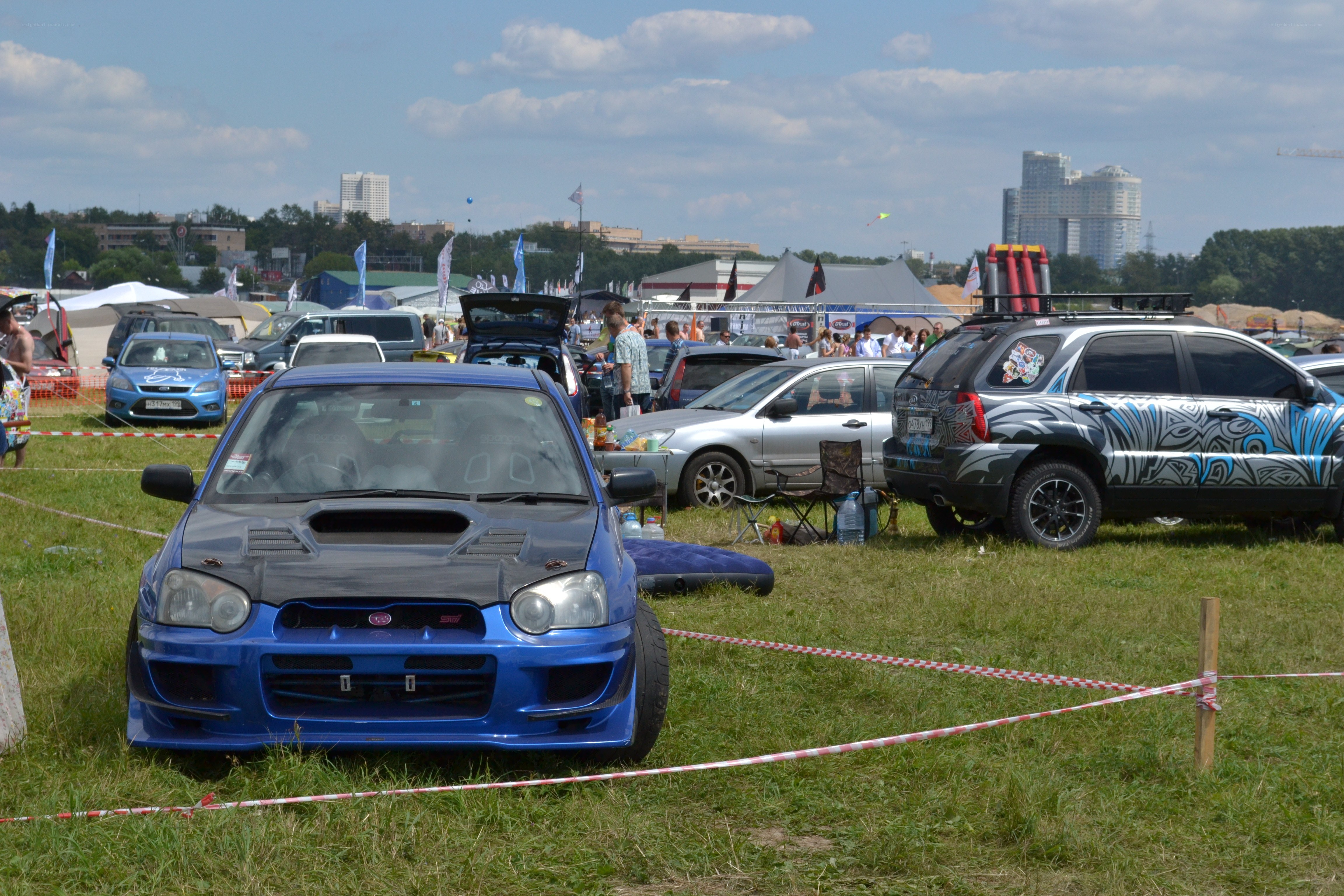 Car show on a grassy field
