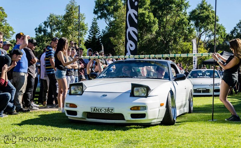 Car show with white sports car
