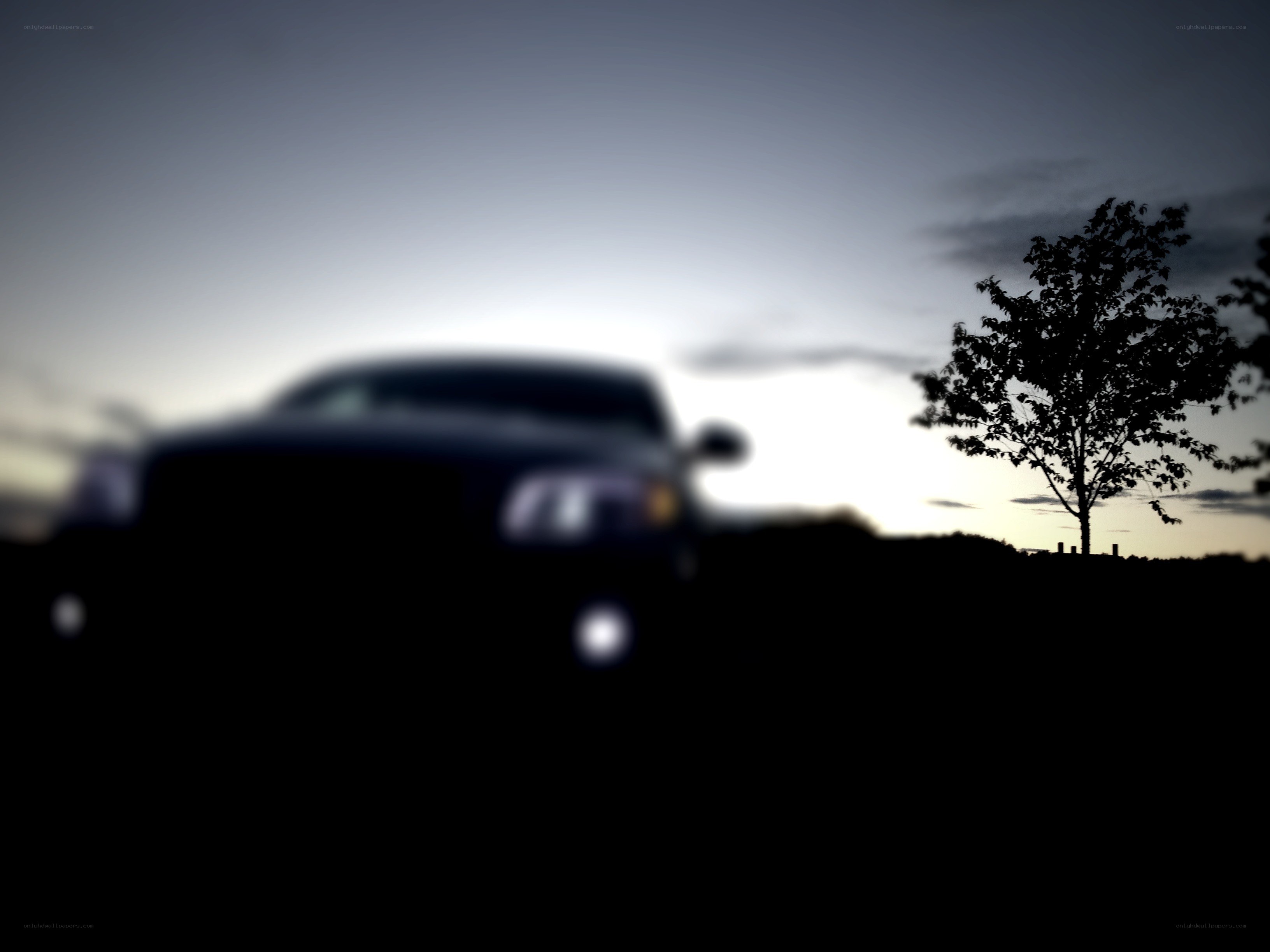 car silhouette at dusk