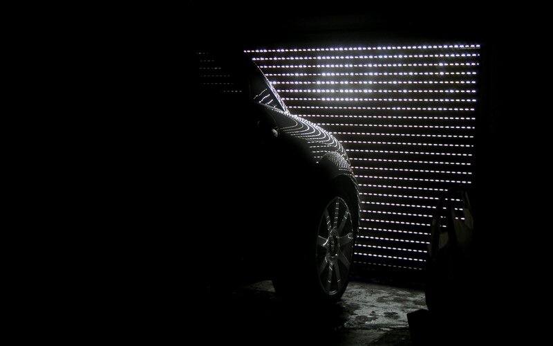 car silhouette in dark garage