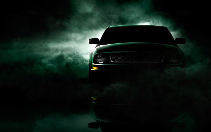 car silhouette in green smoke