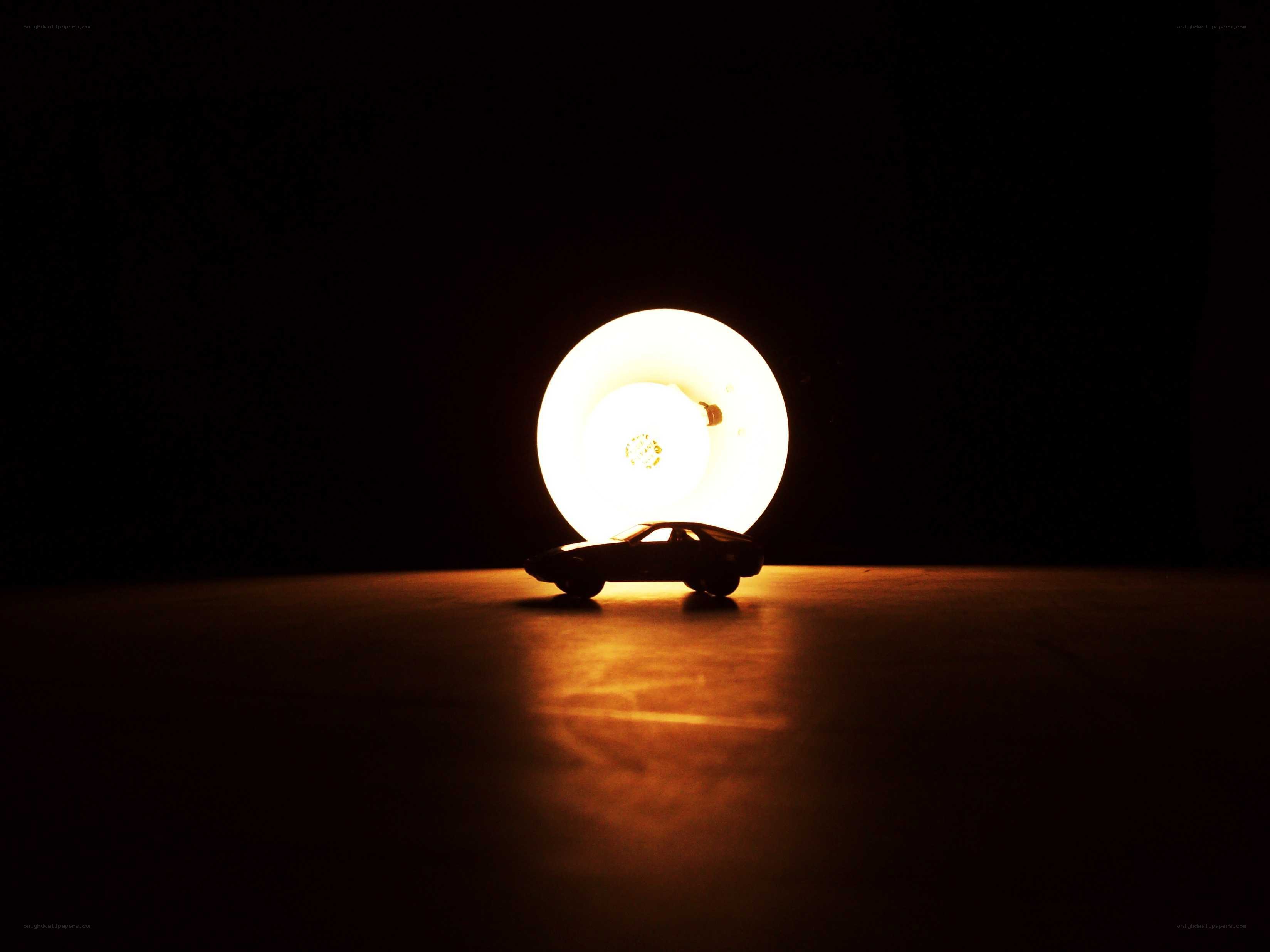 car silhouette with light bulb