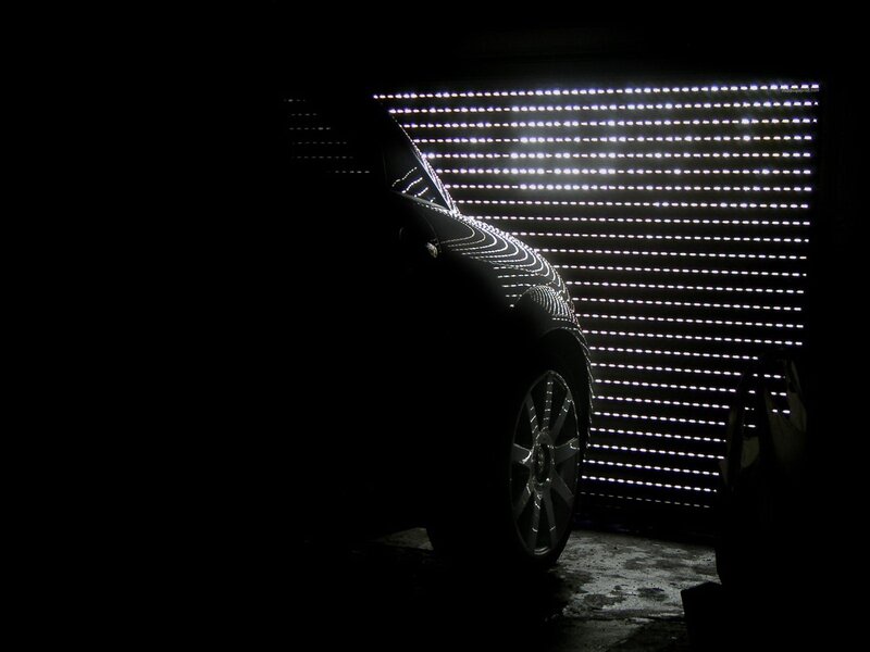 car silhouette with light grid