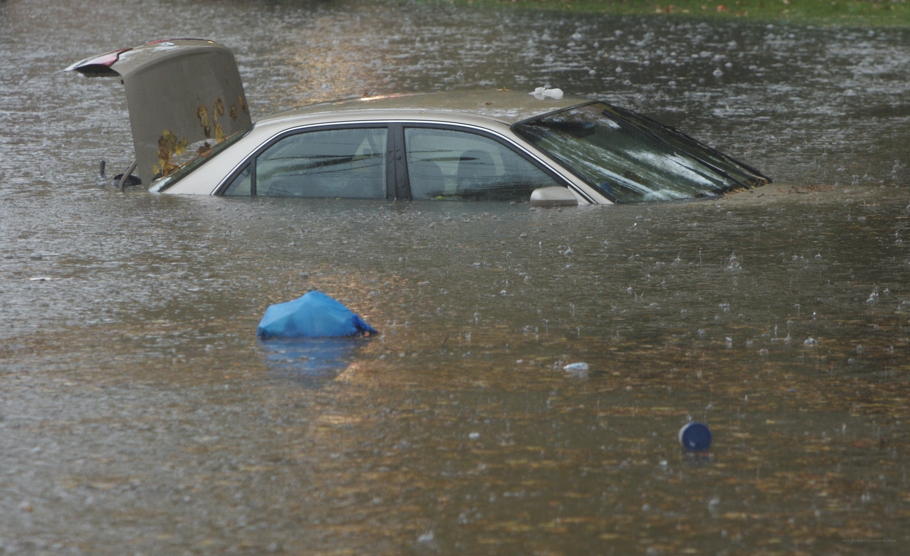 Car submerged in floodwaters