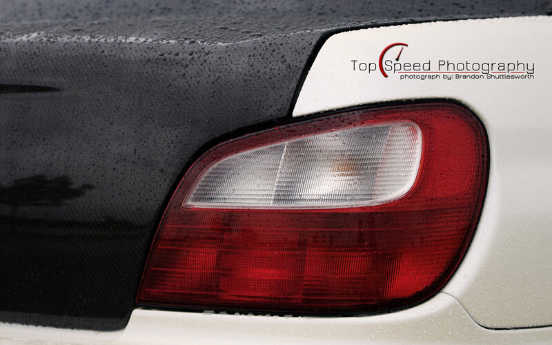 car taillight with water droplets