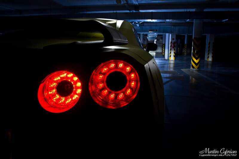 Car taillights in parking garage