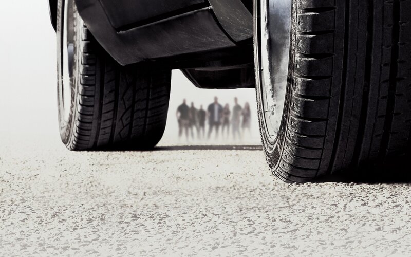 car tires with people in distance