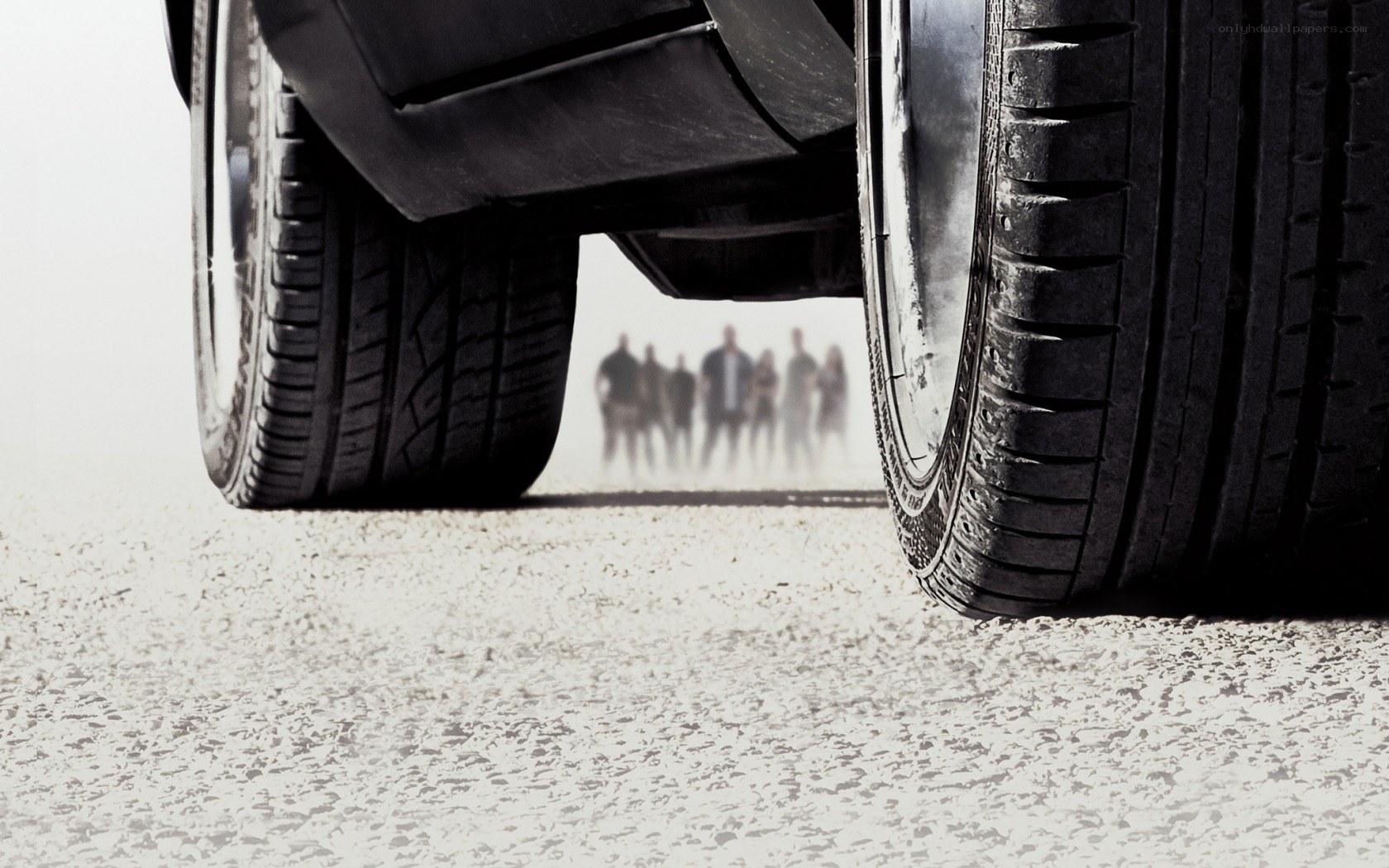 car tires with people in distance