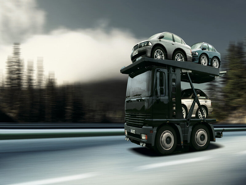 Car transport truck in motion