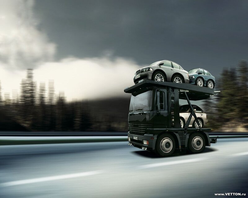 Car transport truck in motion