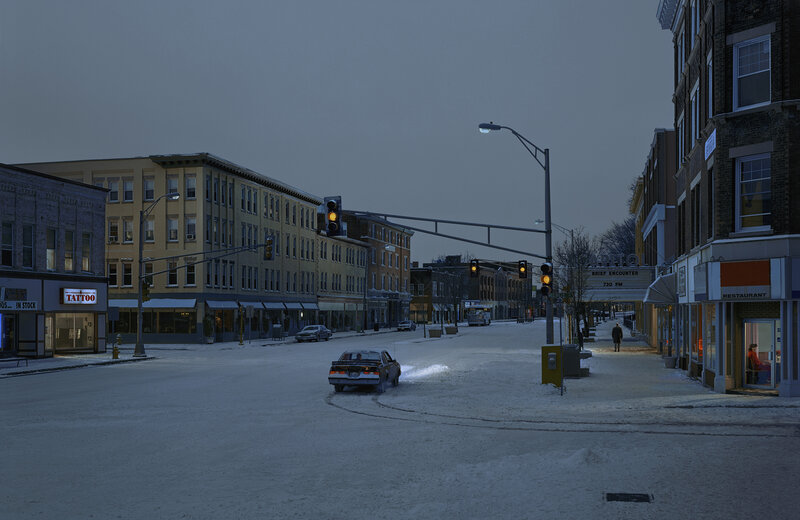 Car Turning on Snowy Street