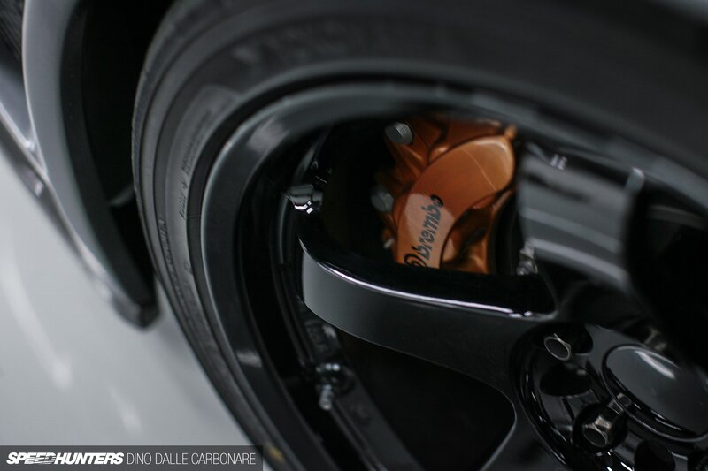 Car Wheel with Brake Caliper — Black, Dramatic, Photograph, Tire