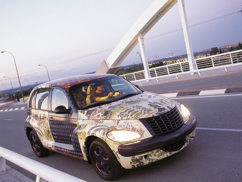 car with decorative wrap on bridge