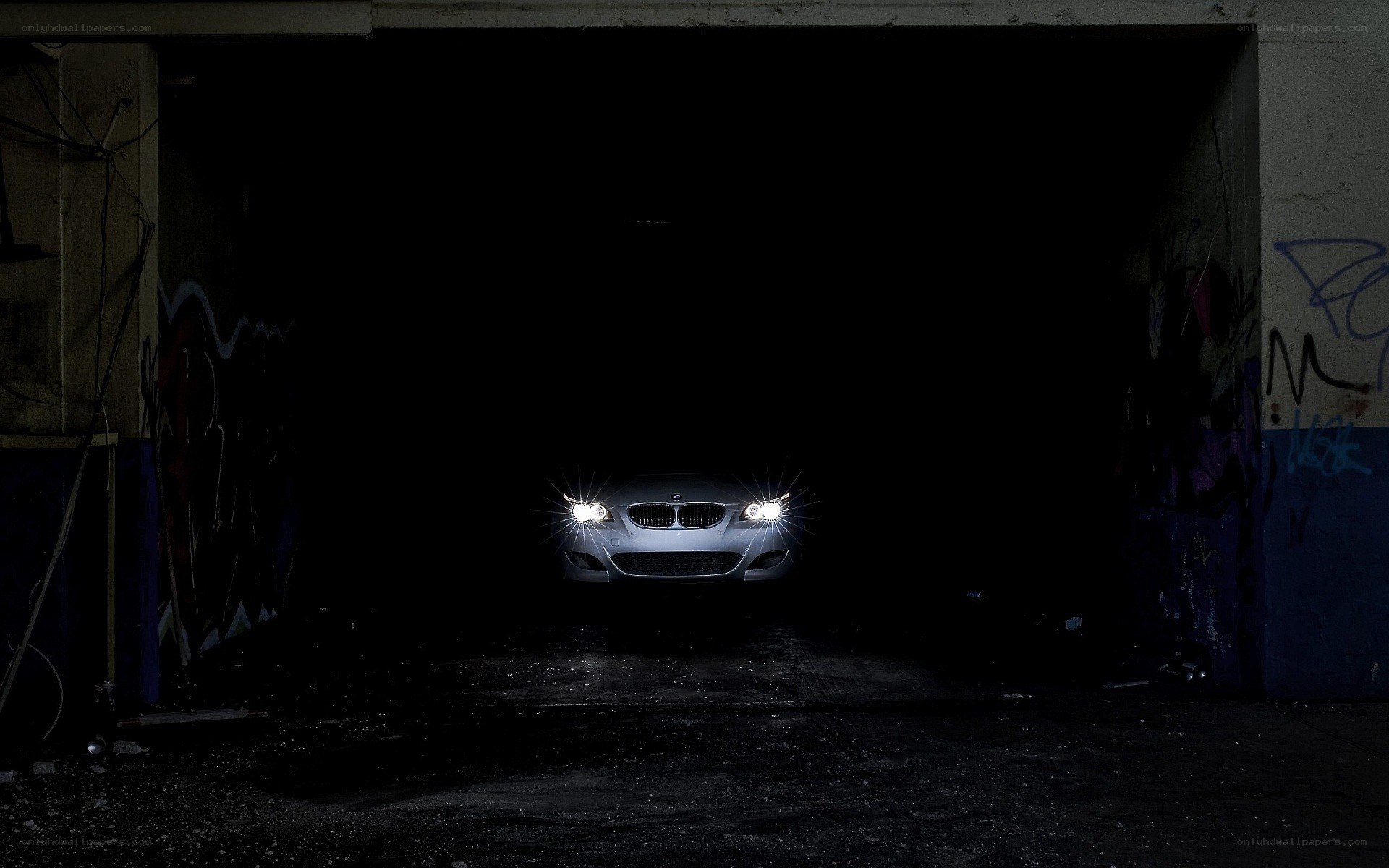 car with headlights on in garage