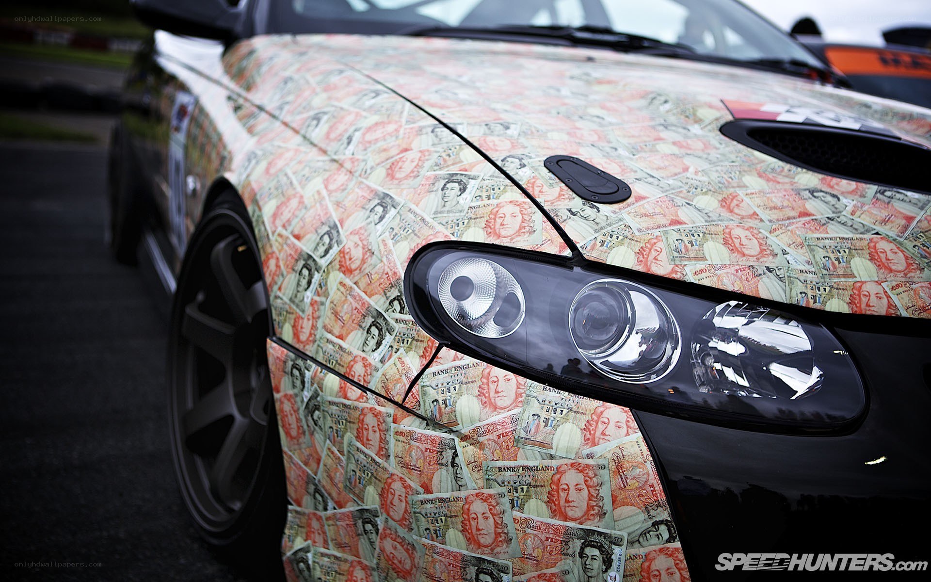 car with money wrap