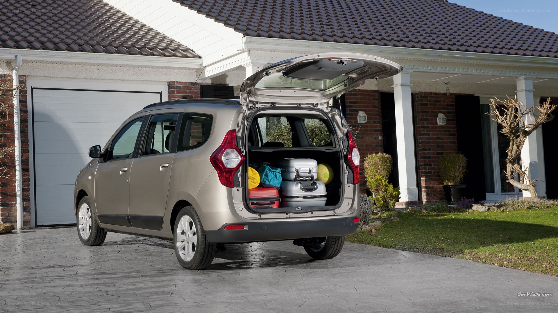 Car with open trunk and luggage