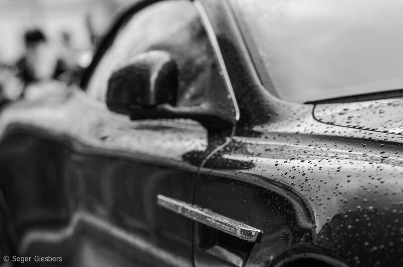 Car with raindrops on surface