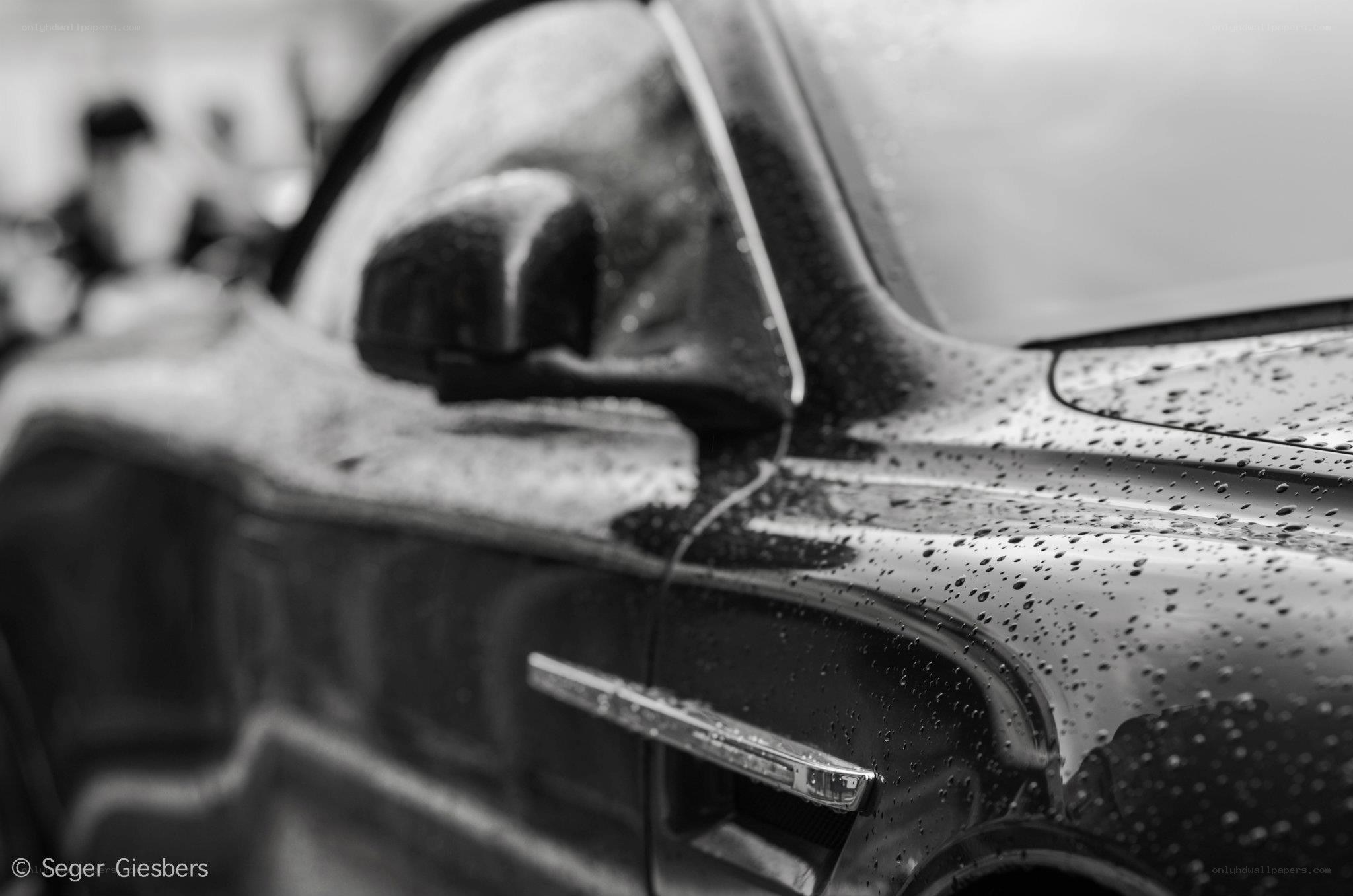 Car with raindrops on surface
