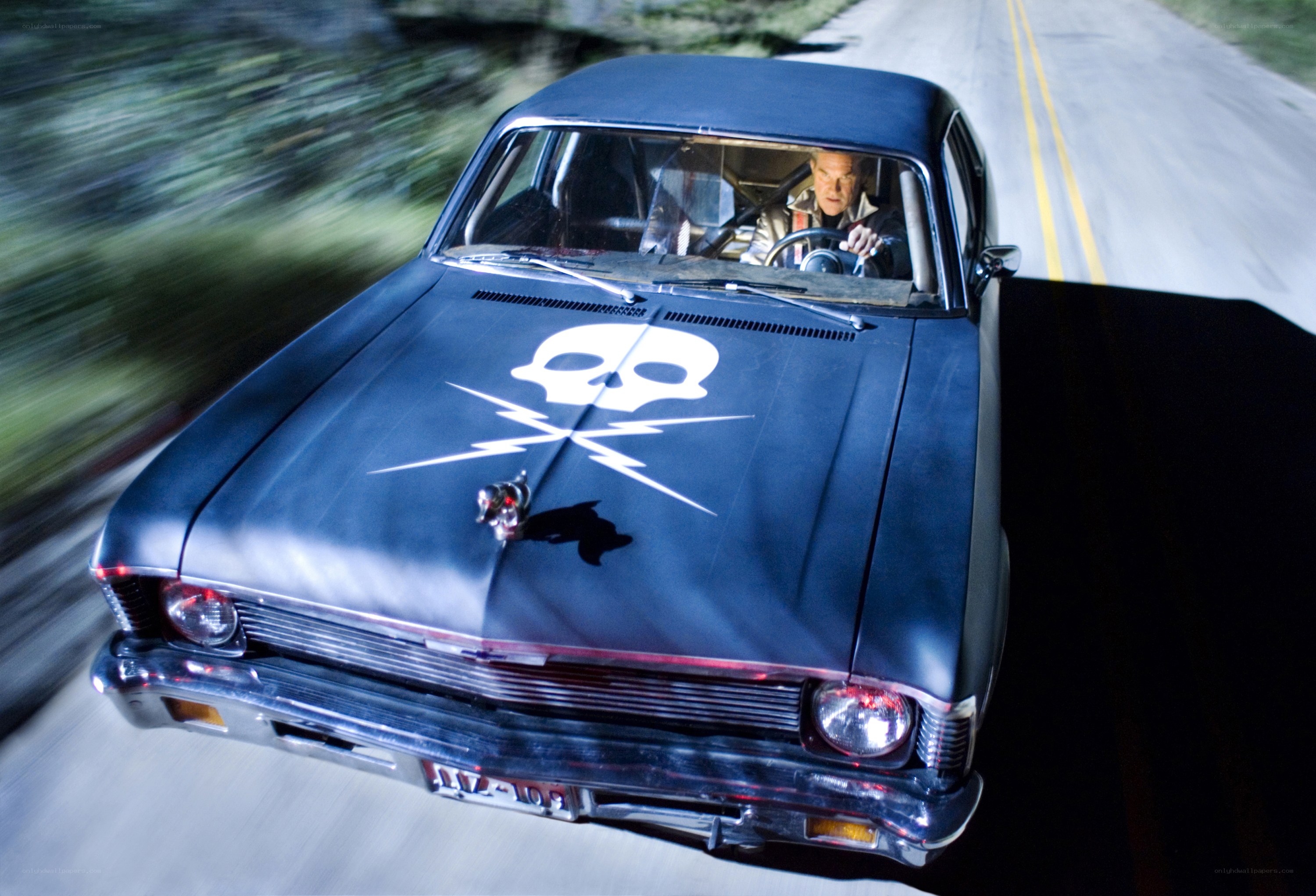 car with skull emblem driving