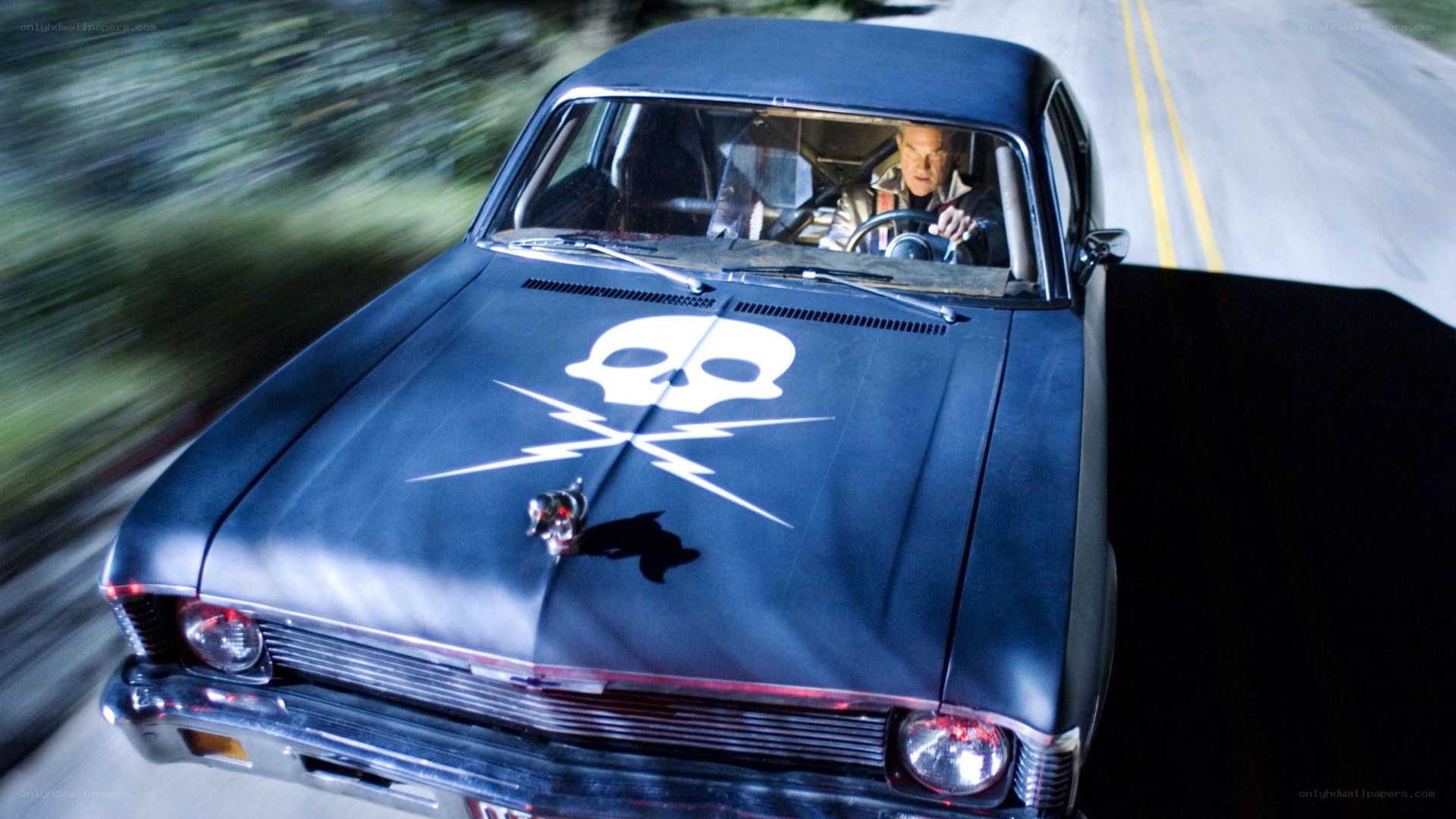 car with skull emblem driving