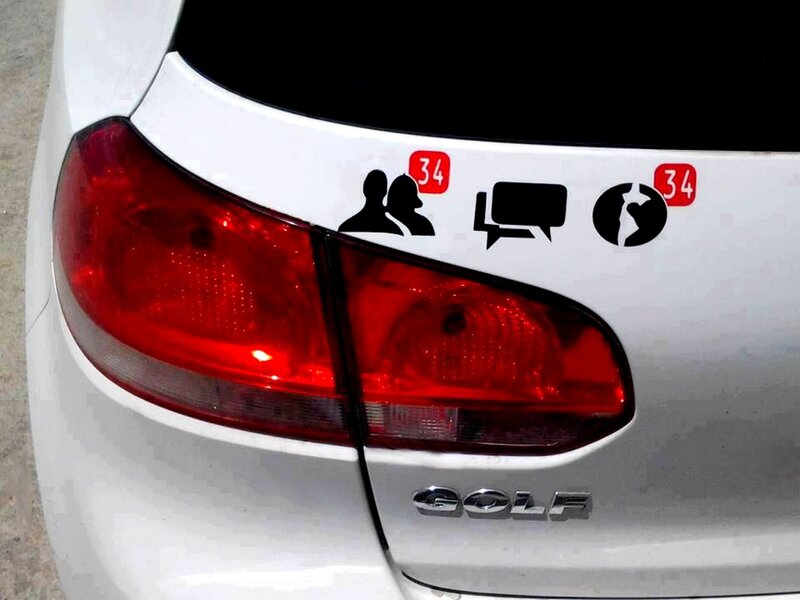 car with social media stickers