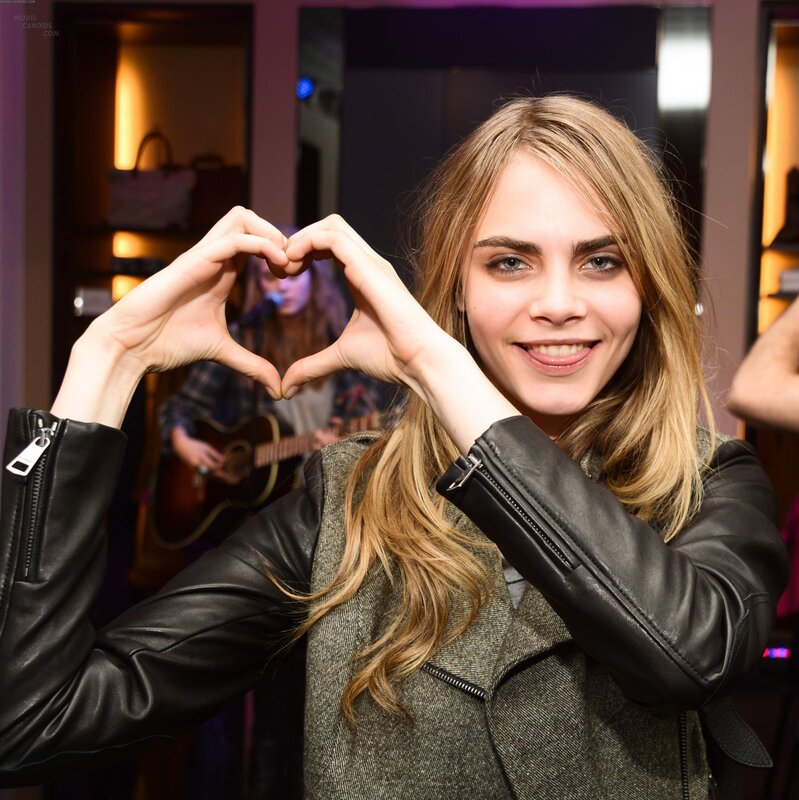 Cara Delevingne making heart shape